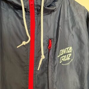 Santa Cruz skateboardards windbreaker jacket. Navy blue and red size large